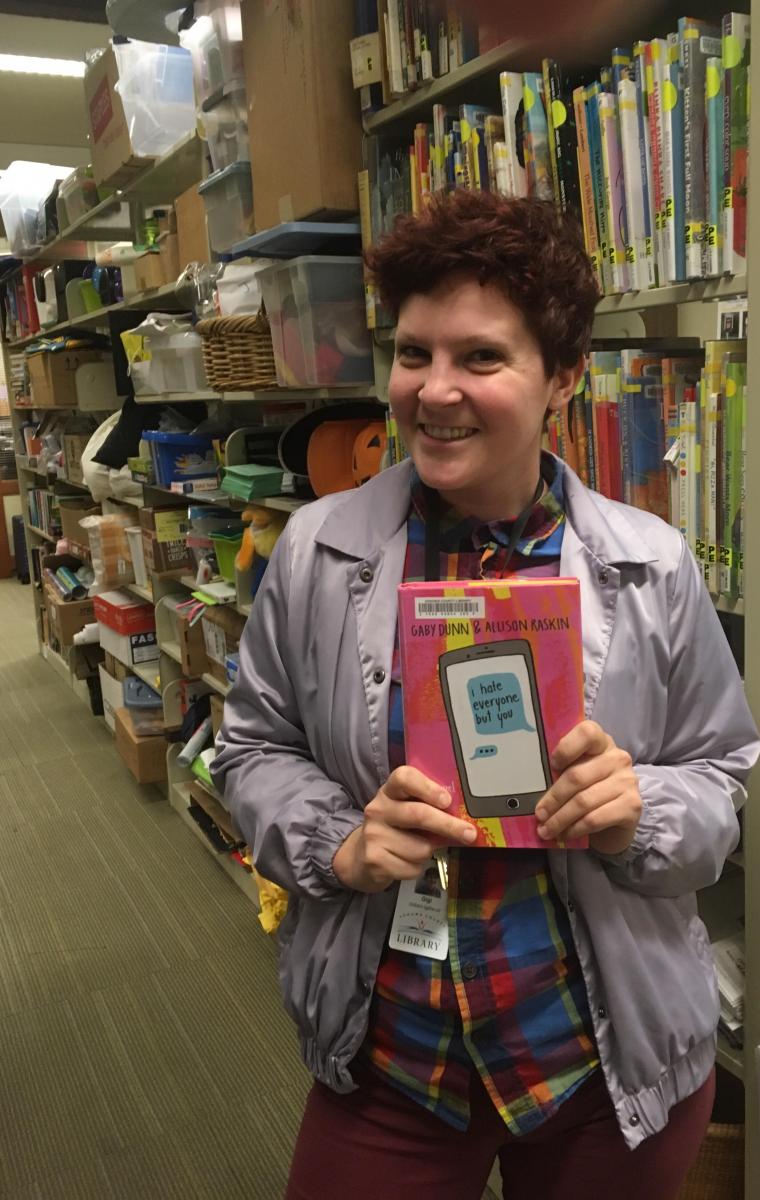 woman holding book "I hate everyone but you" by Gaby Dunn and Alison Raskin