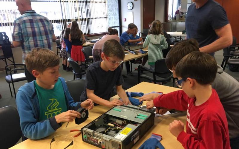 children taking apart computers